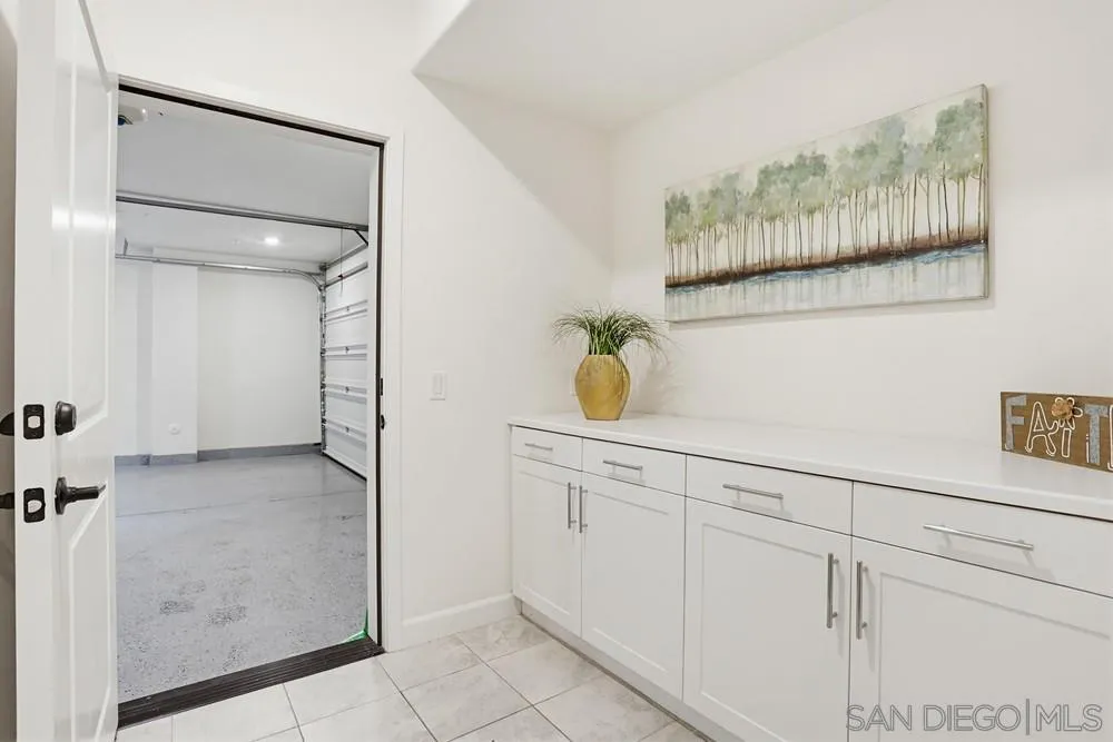 4373 Pacifica Way, Unit 6 Oceanside, CA 92056 - Photo 41 of 48 a kitchen with a sink and cabinets
