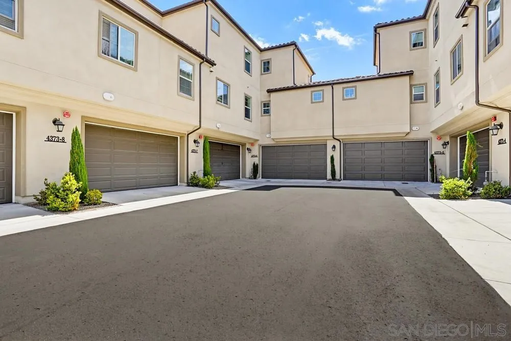 4373 Pacifica Way, Unit 6 Oceanside, CA 92056 - Photo 44 of 48 a view of a house with a street