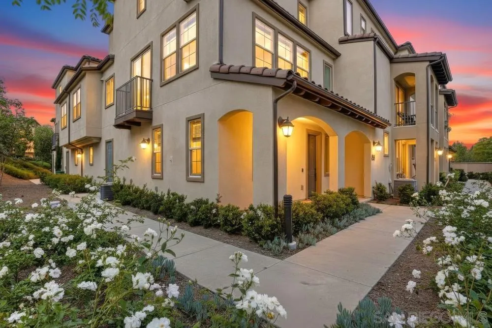 4373 Pacifica Way, Unit 6 Oceanside, CA 92056 - Photo 45 of 48 a view of a building with a lot of flower plants