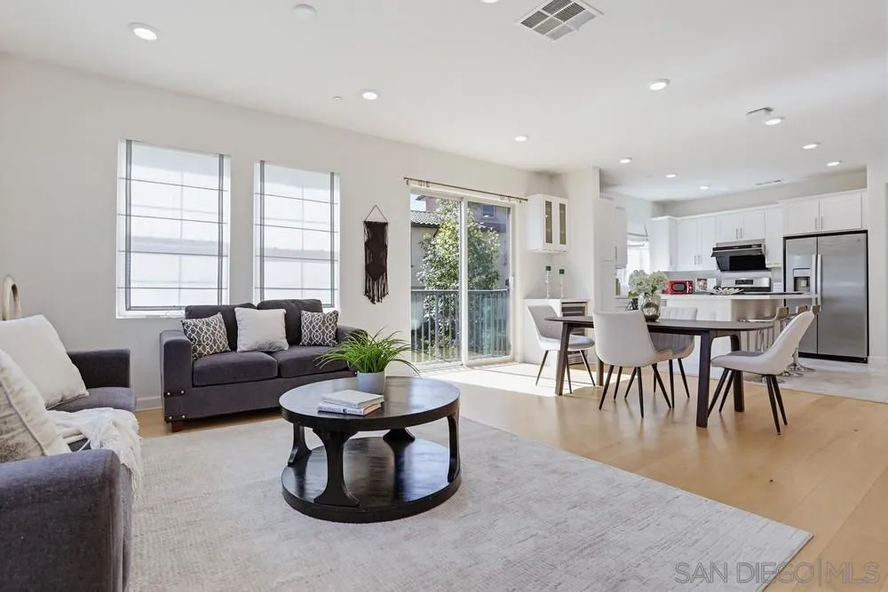 4373 Pacifica Way, Unit 6 Oceanside, CA 92056 - Photo 9 of 48 a living room with furniture and a table