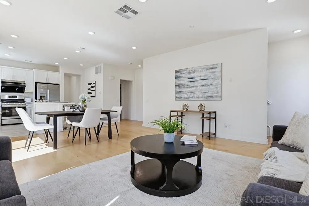 4373 Pacifica Way, Unit 6 Oceanside, CA 92056 - Photo 10 of 48 a living room with furniture potted plant and a table