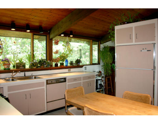 36 Hampshire Road Wayland, MA 01778 - Photo 8 of 21 a kitchen with kitchen island a sink a stove and a refrigerator