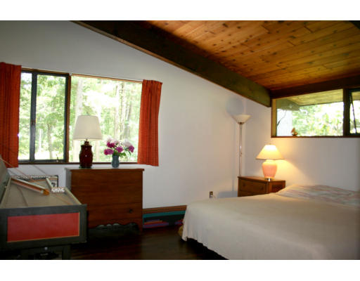 36 Hampshire Road Wayland, MA 01778 - Photo 10 of 21 a bedroom with a bed and large windows