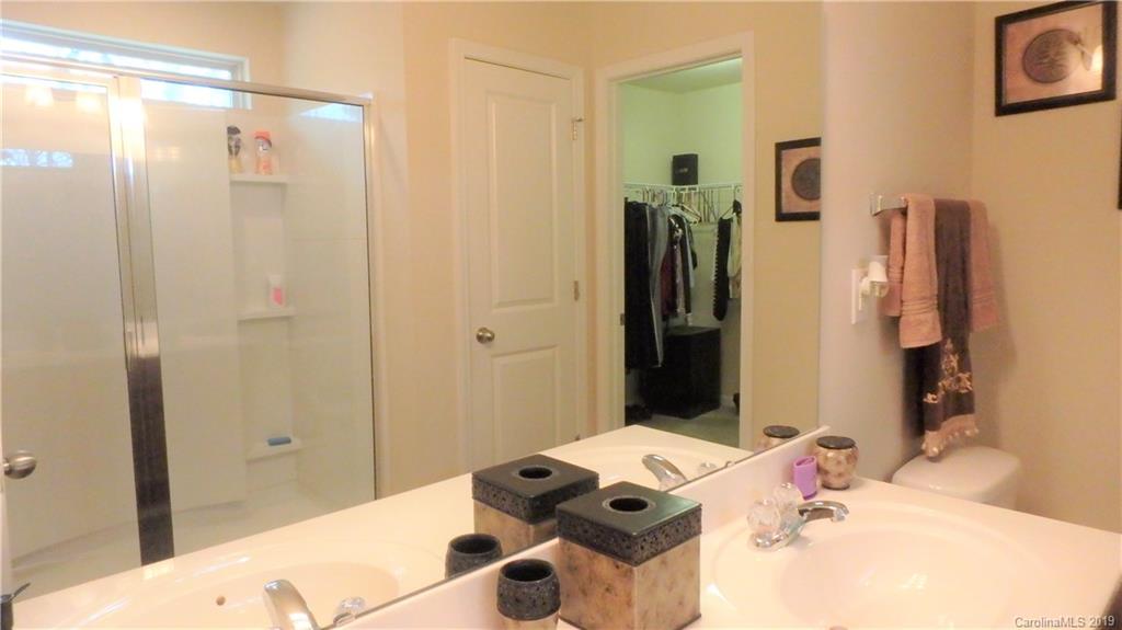 913 Rook Road Charlotte, NC 28216 - Photo 15 of 22 a bathroom with a sink and a mirror