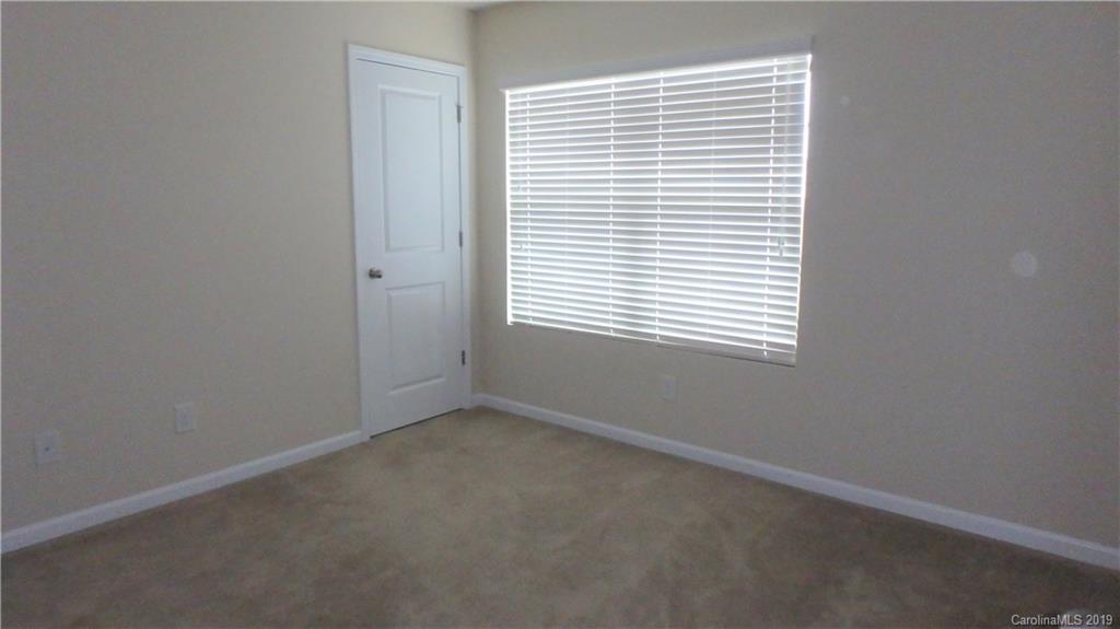 913 Rook Road Charlotte, NC 28216 - Photo 16 of 22 an empty room with a window