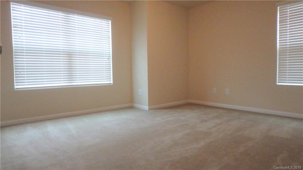 913 Rook Road Charlotte, NC 28216 - Photo 17 of 22 an empty room with a window