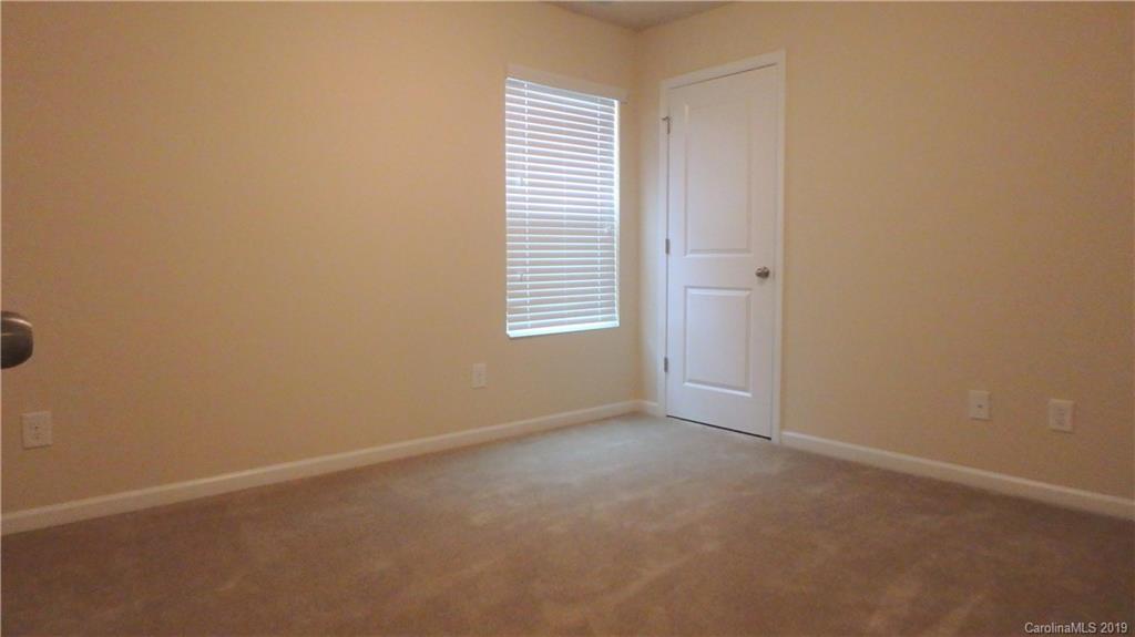 913 Rook Road Charlotte, NC 28216 - Photo 18 of 22 an empty room with windows