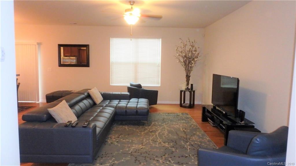 913 Rook Road Charlotte, NC 28216 - Photo 3 of 22 a living room with furniture and a flat screen tv