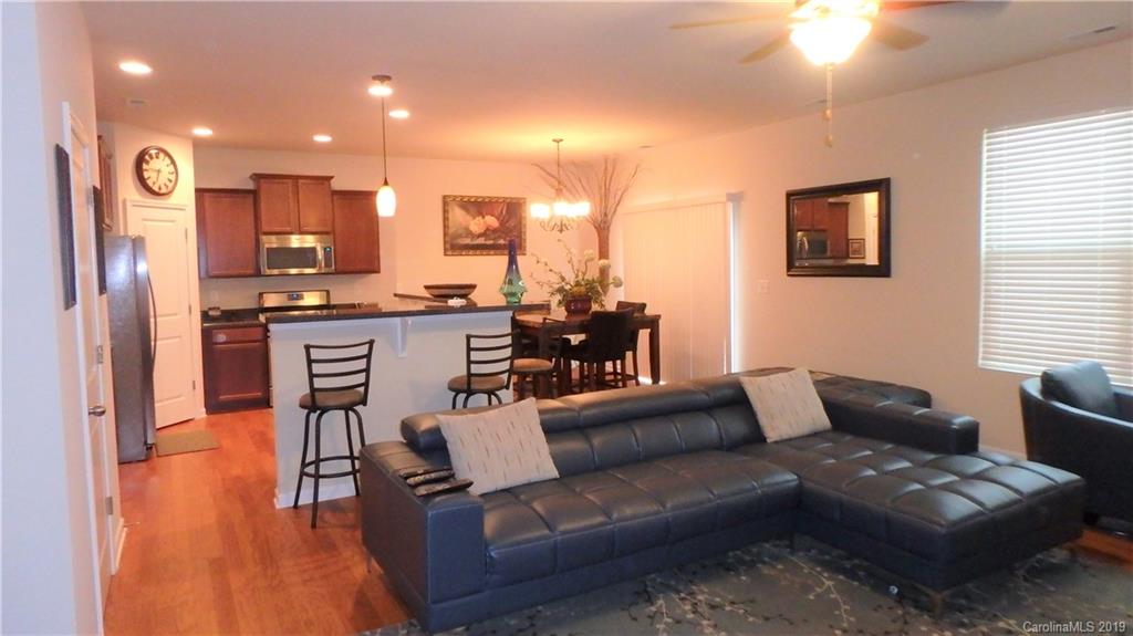 913 Rook Road Charlotte, NC 28216 - Photo 4 of 22 a living room with furniture and a wooden floor