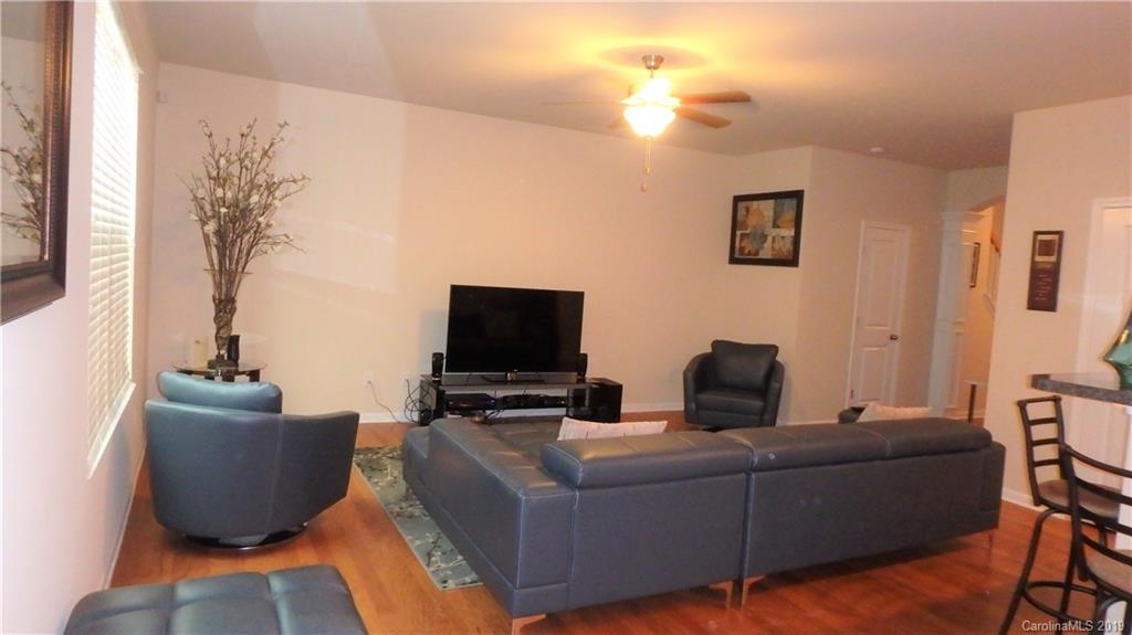 913 Rook Road Charlotte, NC 28216 - Photo 6 of 22 a living room with furniture and a flat screen tv