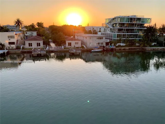 a view of a lake with a building in the background