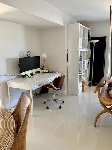 a workspace with furniture and gym equipment