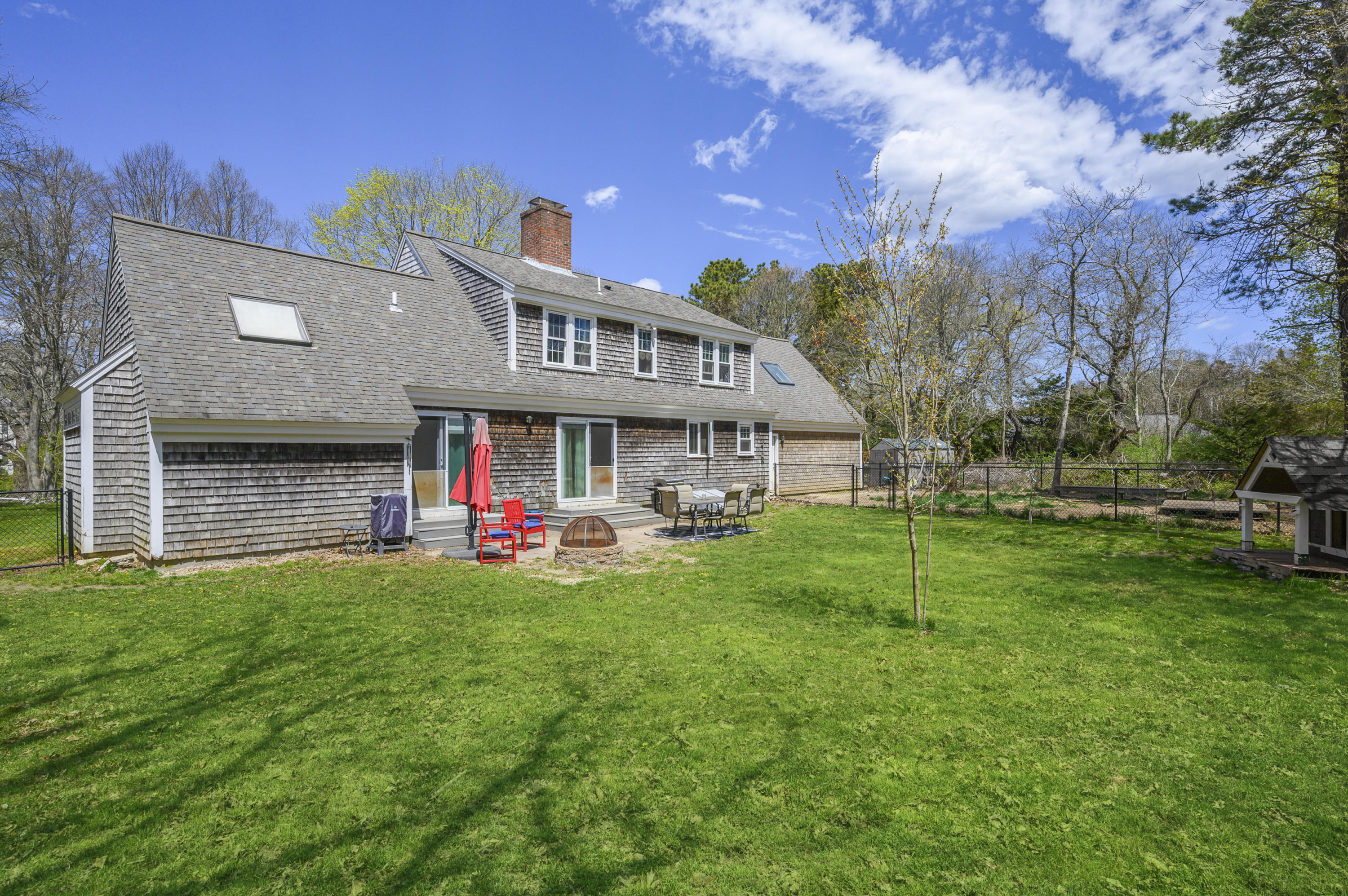 29 Old Kings Road Cotuit, MA 02635 - Photo 30 of 30 a view of a house with a yard and sitting area