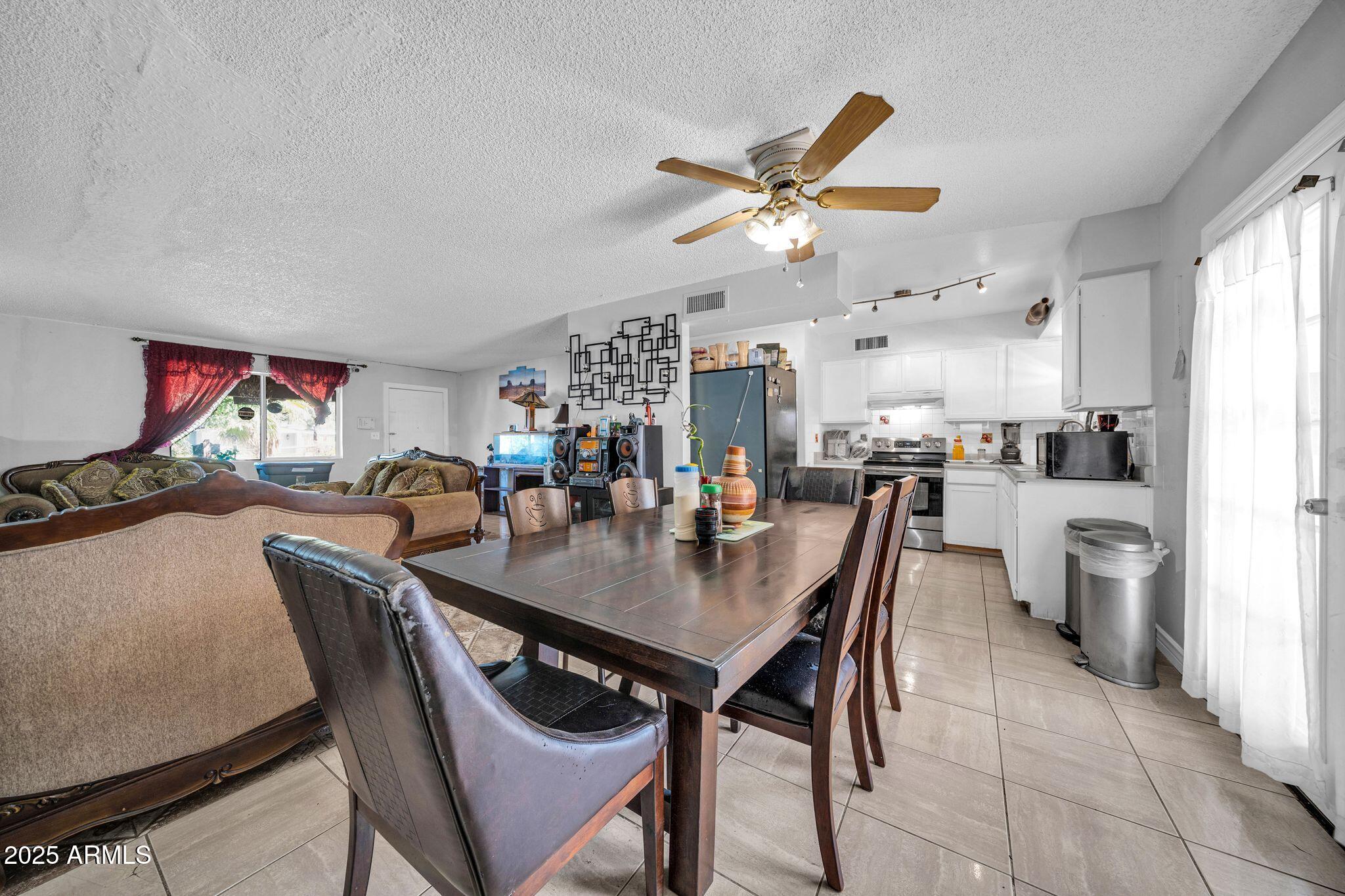 7629 West Osborn Road Phoenix, AZ 85033 - Photo 11 of 43 Dining to great room and kitchen