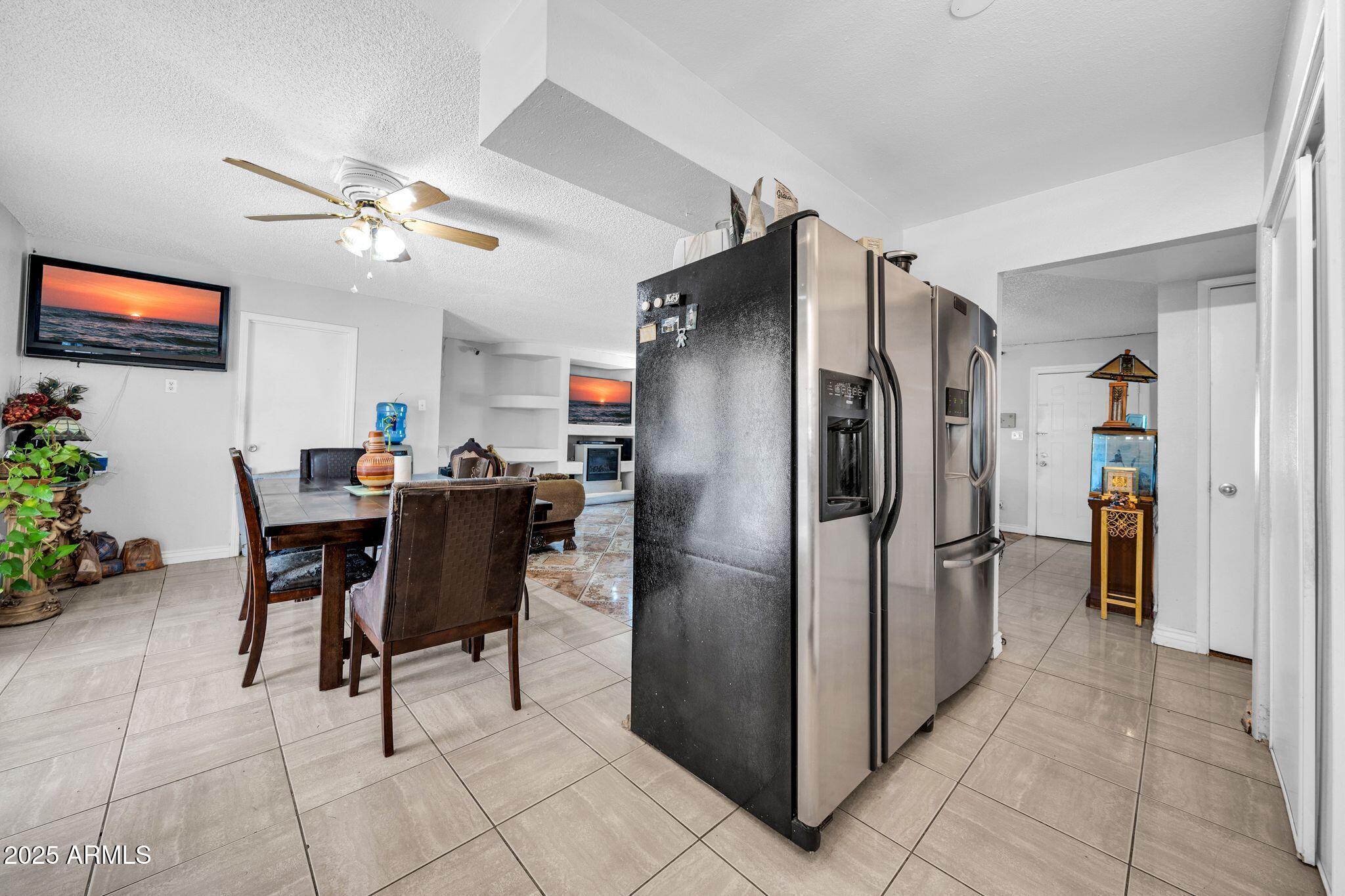 7629 West Osborn Road Phoenix, AZ 85033 - Photo 14 of 43 Open kitchen to dining