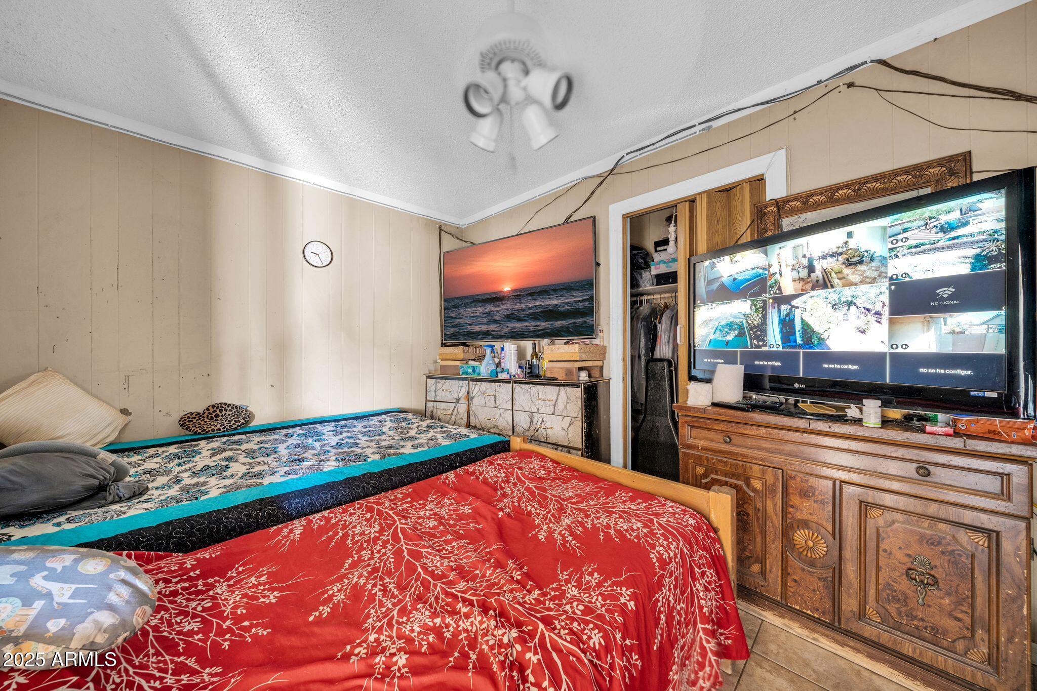 7629 West Osborn Road Phoenix, AZ 85033 - Photo 26 of 43 Bedroom 4 with walk-in closet.