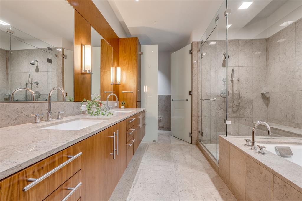 1918 Olive Street, Unit 701 Dallas, TX 75201 - Photo 17 of 40 a bathroom with a granite countertop sink mirror double and shower