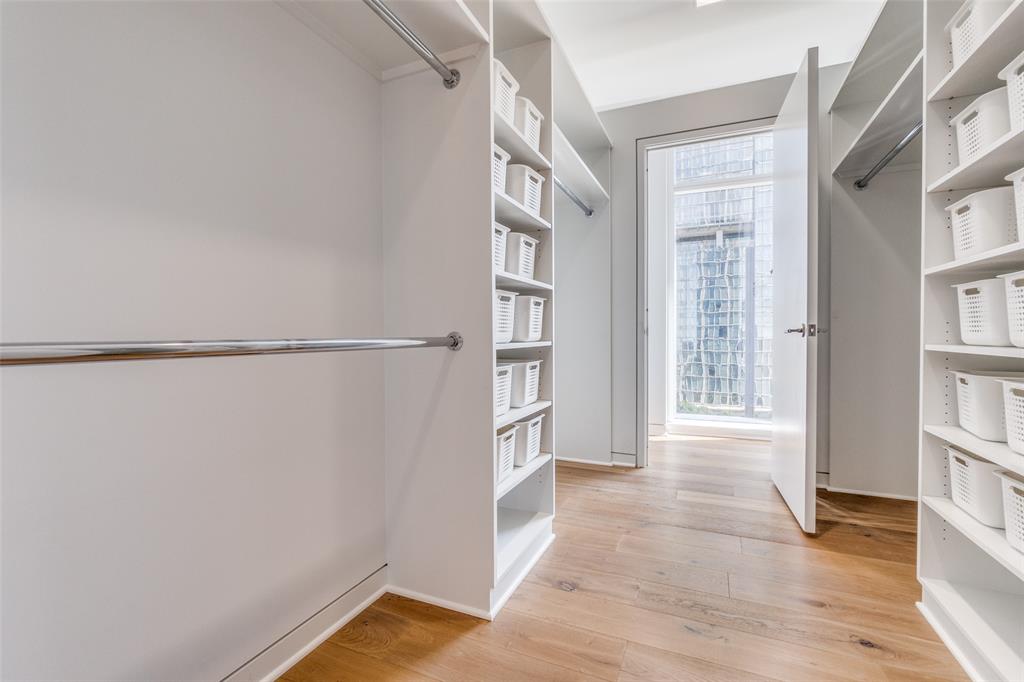 1918 Olive Street, Unit 701 Dallas, TX 75201 - Photo 18 of 40 a view of an empty room with a window and wooden floor