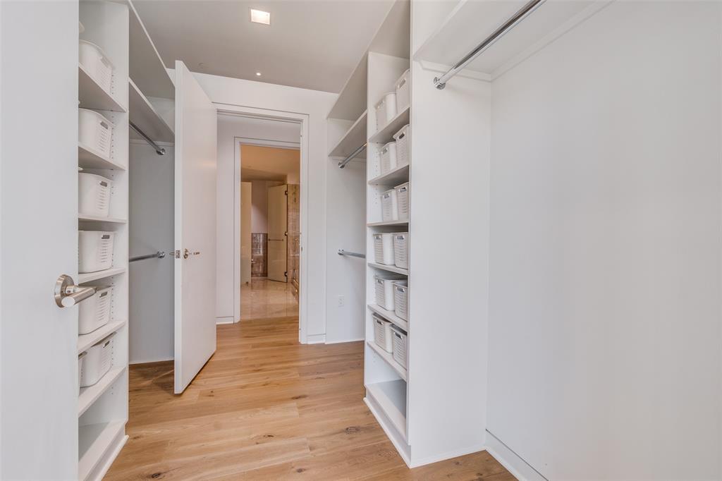 1918 Olive Street, Unit 701 Dallas, TX 75201 - Photo 19 of 40 a view of a hallway with wooden floor and staircase