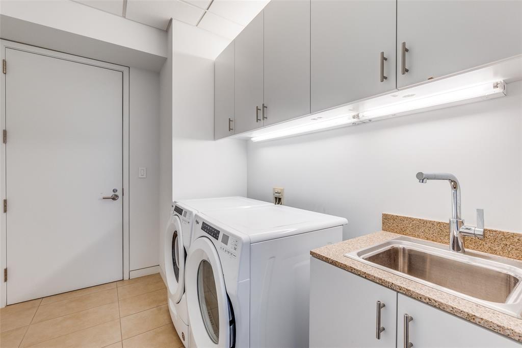 1918 Olive Street, Unit 701 Dallas, TX 75201 - Photo 22 of 40 a utility room with sink dryer and washer