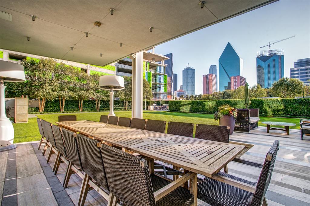 1918 Olive Street, Unit 701 Dallas, TX 75201 - Photo 37 of 40 a view of an outside dining space with furniture window and wooden floor