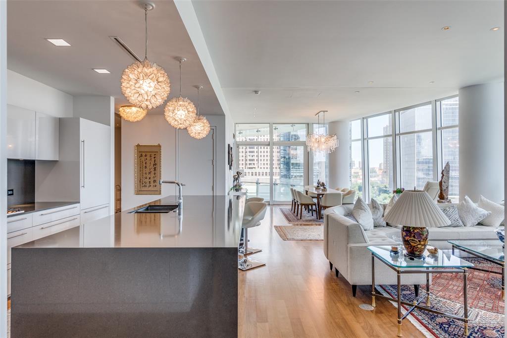 1918 Olive Street, Unit 701 Dallas, TX 75201 - Photo 10 of 40 a living room with fireplace furniture and a large window