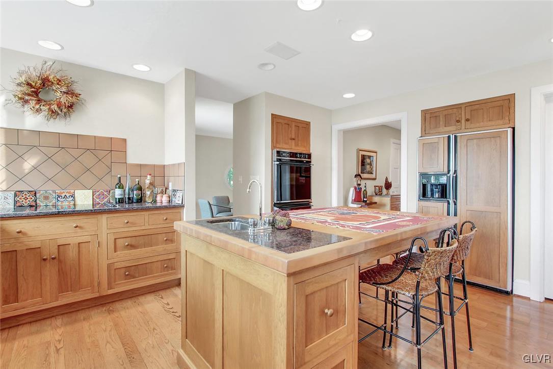 475 Rebers Bridge Road Reading, PA 19608 - Photo 14 of 30 a dining hall with stainless steel appliances granite countertop a dining table chairs and granite counter tops