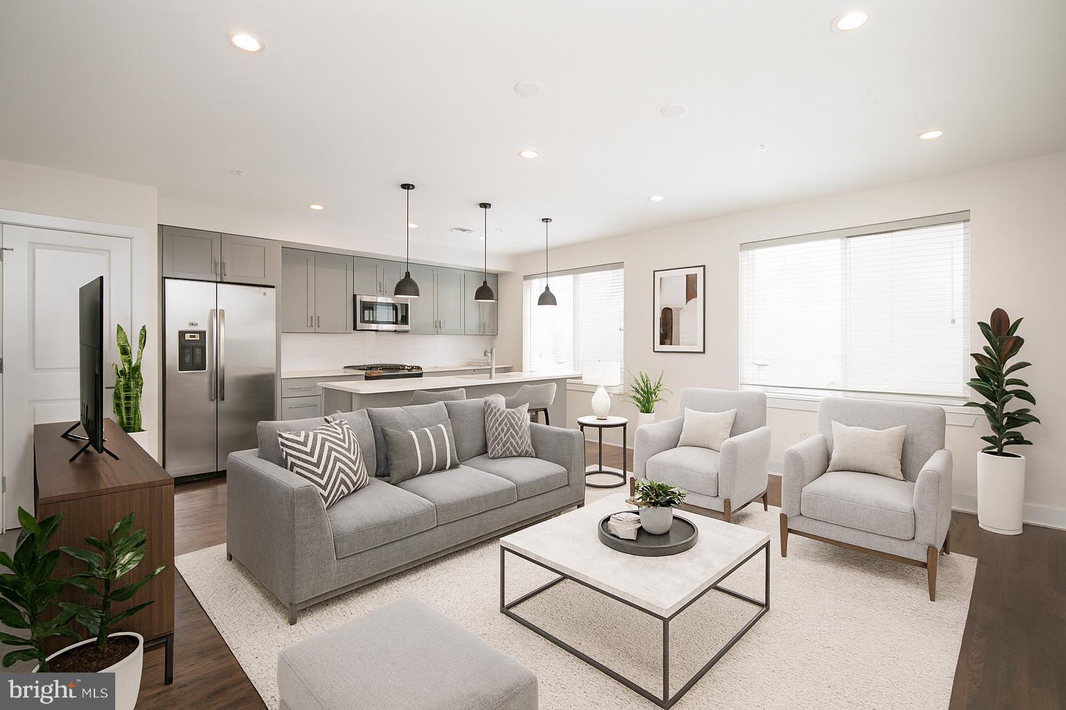 a living room with furniture white walls and white walls