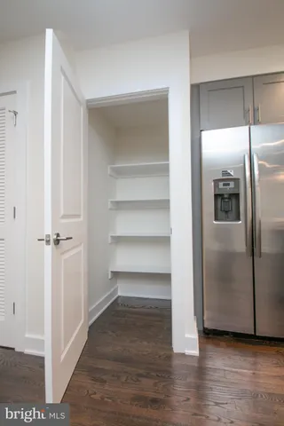 a view of a room with wooden floor