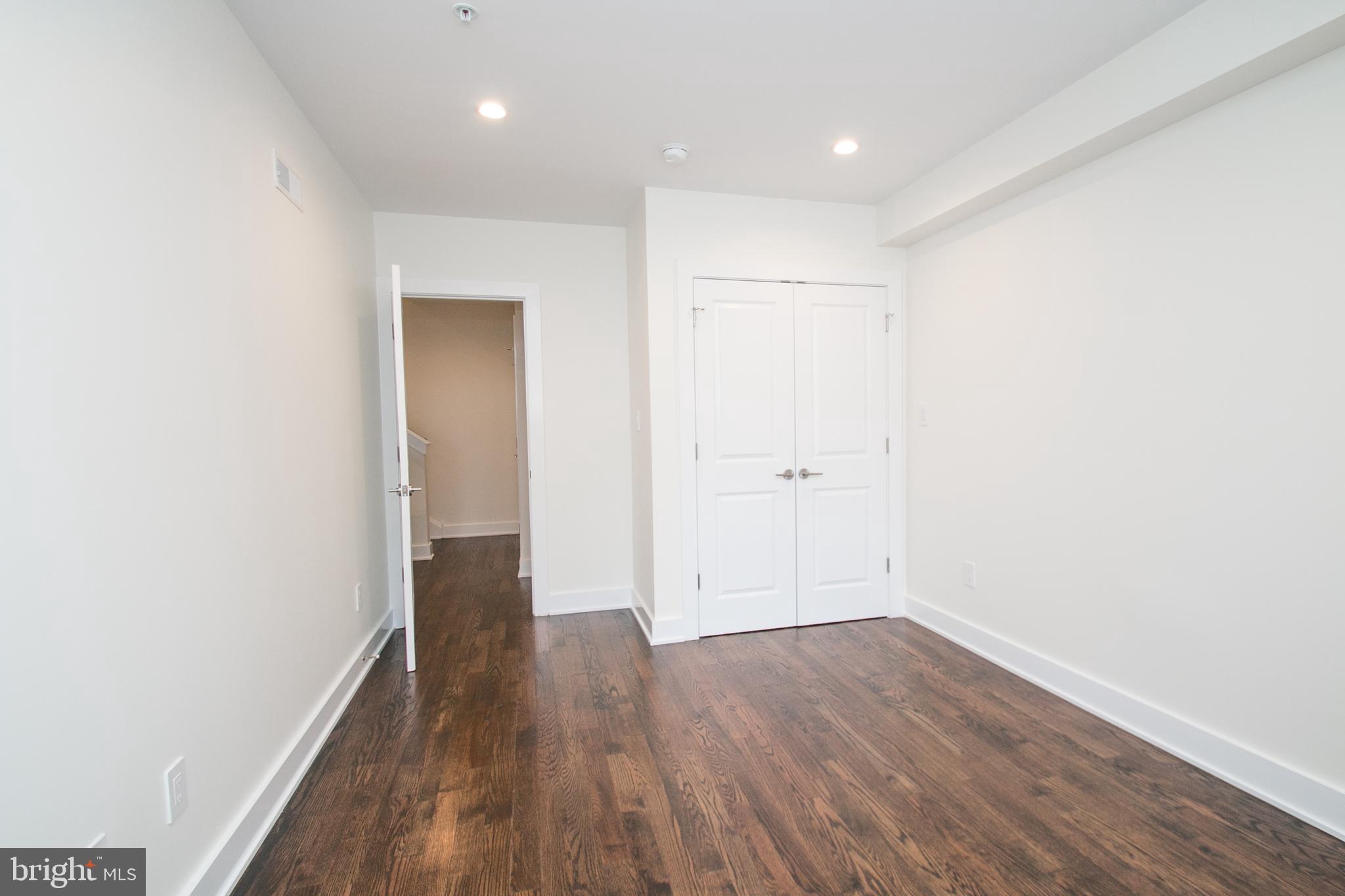 1022-24 South 2nd Street, Unit 4 Philadelphia, PA 19147 - Photo 18 of 50 wooden floor in a hall with an empty room