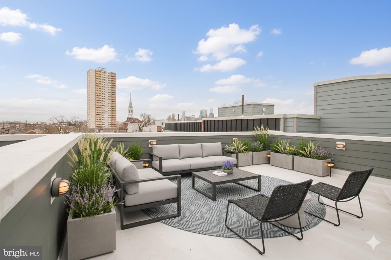 1022-24 South 2nd Street, Unit 4 Philadelphia, PA 19147 - Photo 36 of 50 a balcony with furniture and city view
