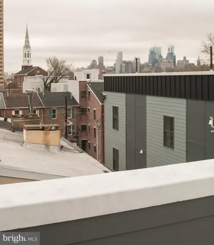 a city street lined with buildings and cars