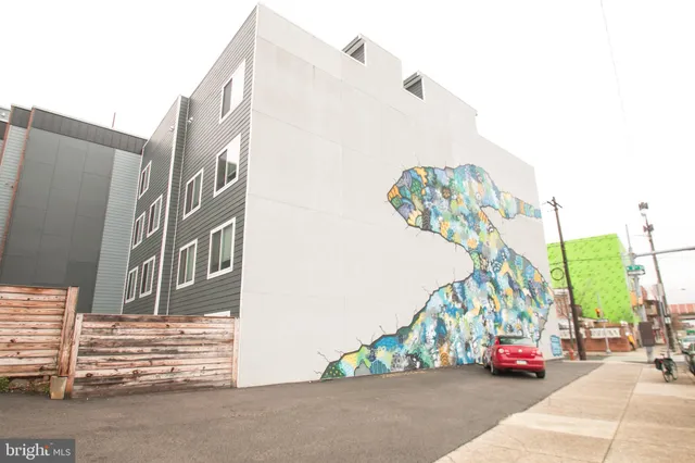 a view of a car parked in front of a building