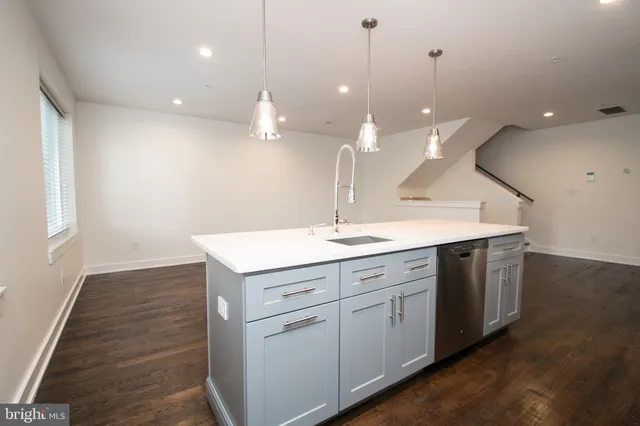 a bathroom with a sink vanity and a mirror