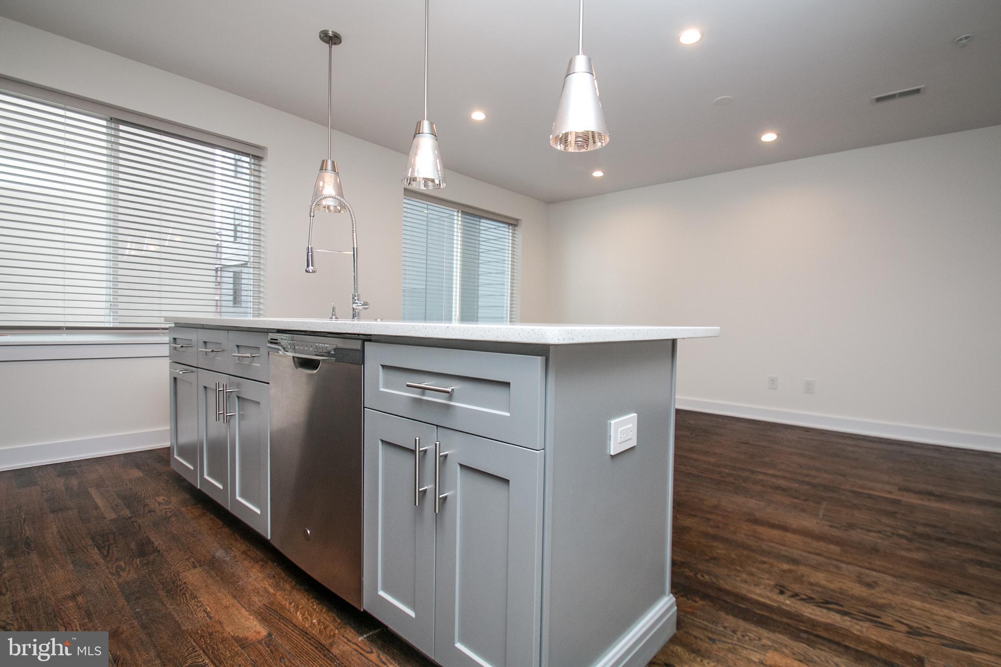 1022-24 South 2nd Street, Unit 4 Philadelphia, PA 19147 - Photo 10 of 50 a kitchen with a sink cabinets and wooden floor