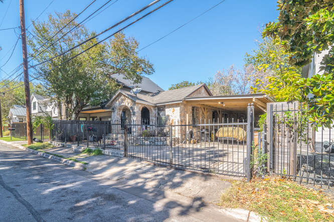 2406 Santa Maria Street Austin, TX 78702 - Photo 3 of 6 a view of a house with a small yard and wooden fence