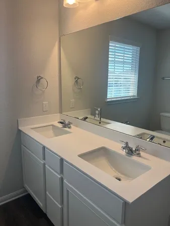 an empty room with a bathroom