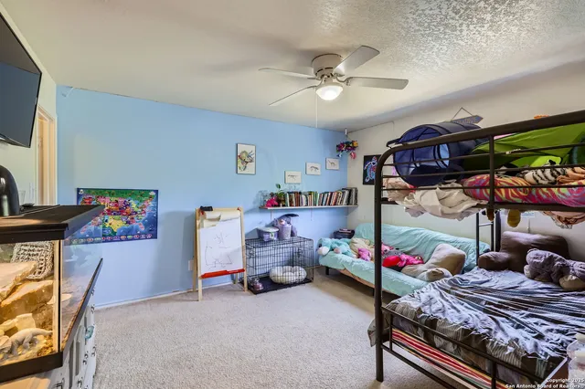 a bedroom with furniture and a chandelier