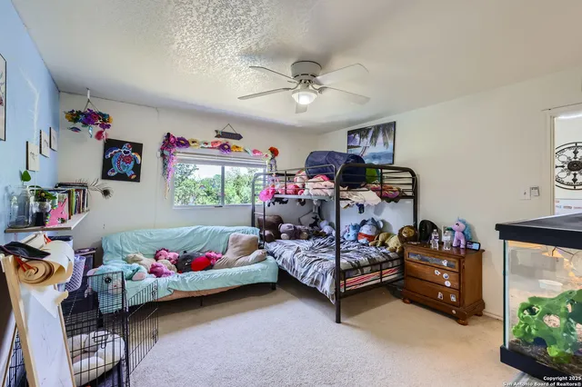 a bedroom with furniture a bed and a window
