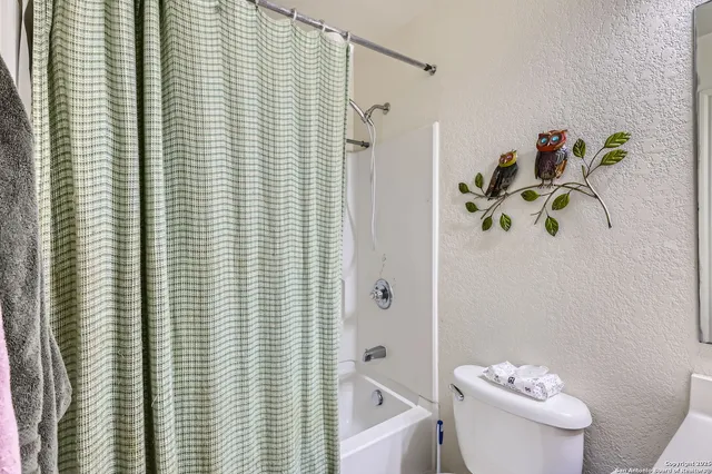 a bathroom with a shower curtain