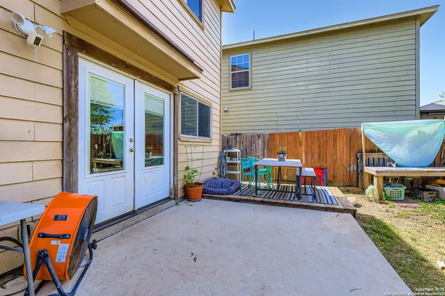 an outdoor sitting area with chairs and couch