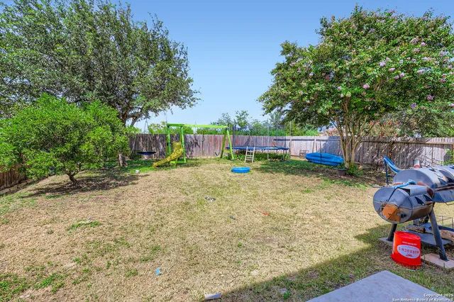 a backyard of a house with lots of green space