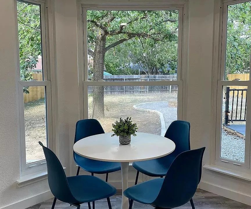 2502 Tracy Cove Leander, TX 78641 - Photo 12 of 34 a view of a dining room with furniture window and wooden floor