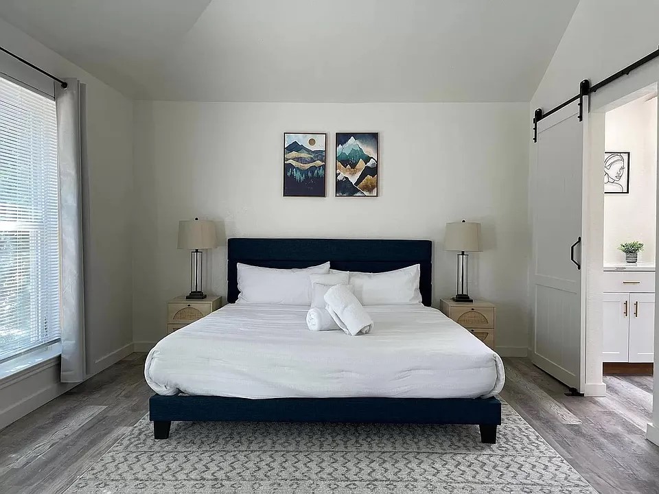 2502 Tracy Cove Leander, TX 78641 - Photo 18 of 34 a bedroom with a bed and a window