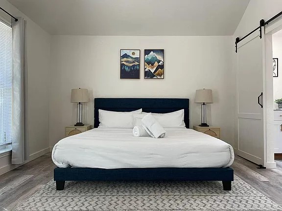 2502 Tracy Cove Leander, TX 78641 - Photo 20 of 34 a bedroom with a bed and painting on the wall