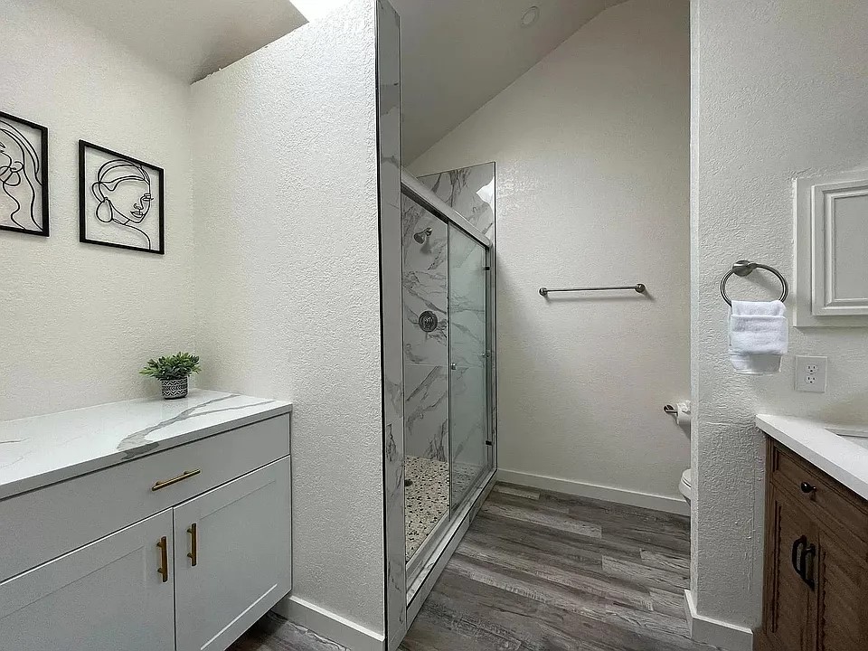 2502 Tracy Cove Leander, TX 78641 - Photo 24 of 34 a bathroom with a granite countertop sink and a mirror
