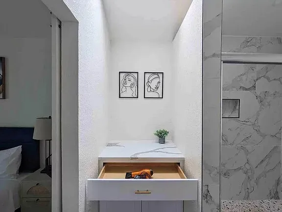 a spacious bedroom with a bed and a chair