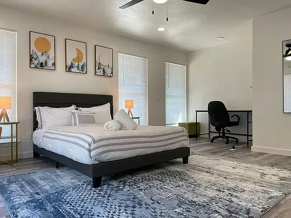 a bedroom with a bed and chair
