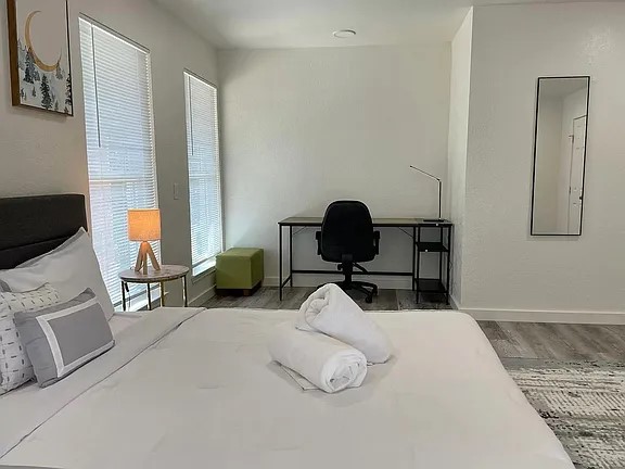 2502 Tracy Cove Leander, TX 78641 - Photo 28 of 34 a bedroom with a bed and chair