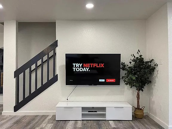 2502 Tracy Cove Leander, TX 78641 - Photo 4 of 34 Detailed view of wood finished floors and recessed lighting